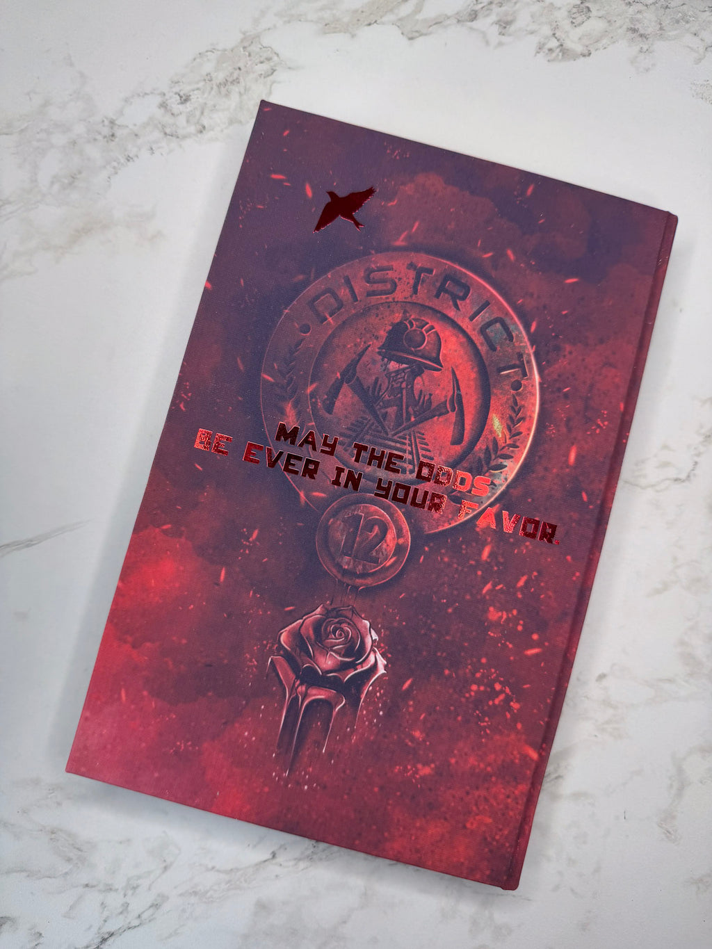 The Hunger Games by Suzanne Collins in Collaboration with Atreiyus