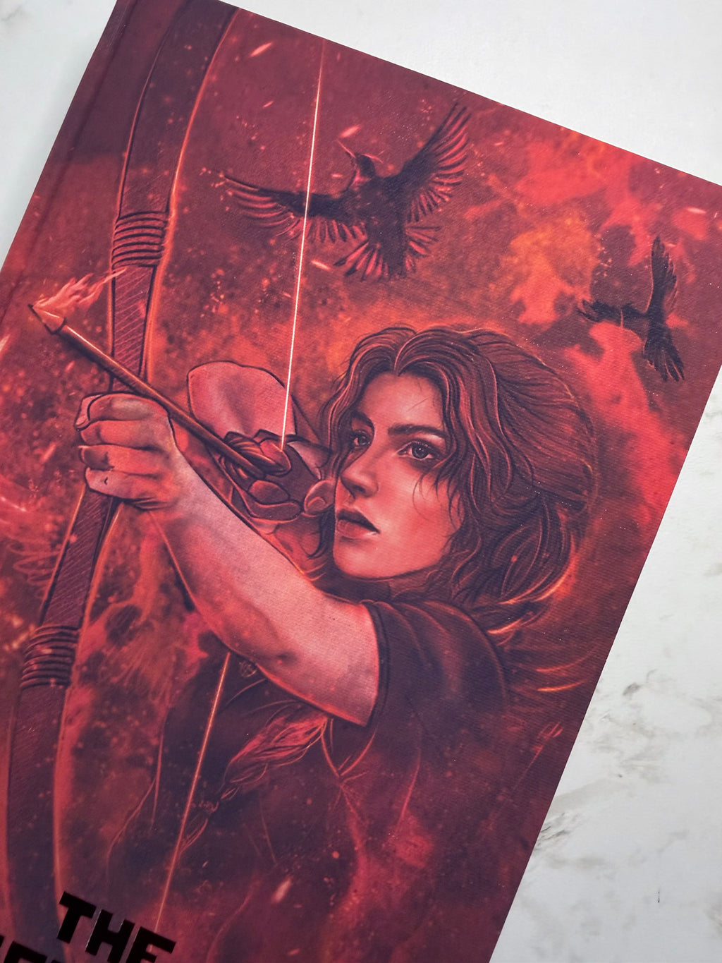 The Hunger Games by Suzanne Collins in Collaboration with Atreiyus