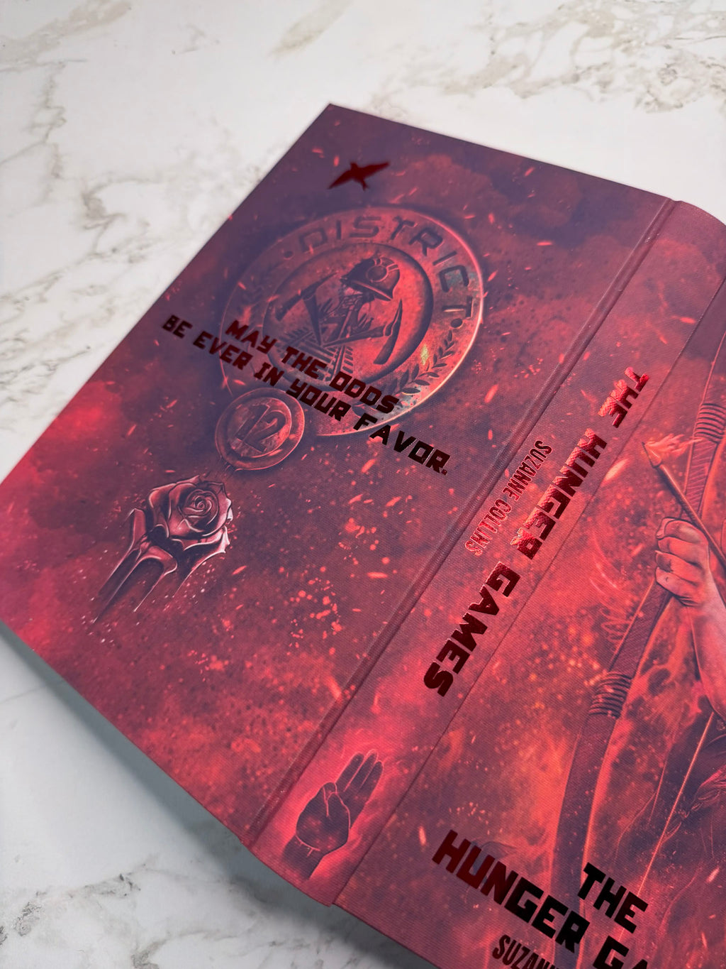 The Hunger Games by Suzanne Collins in Collaboration with Atreiyus
