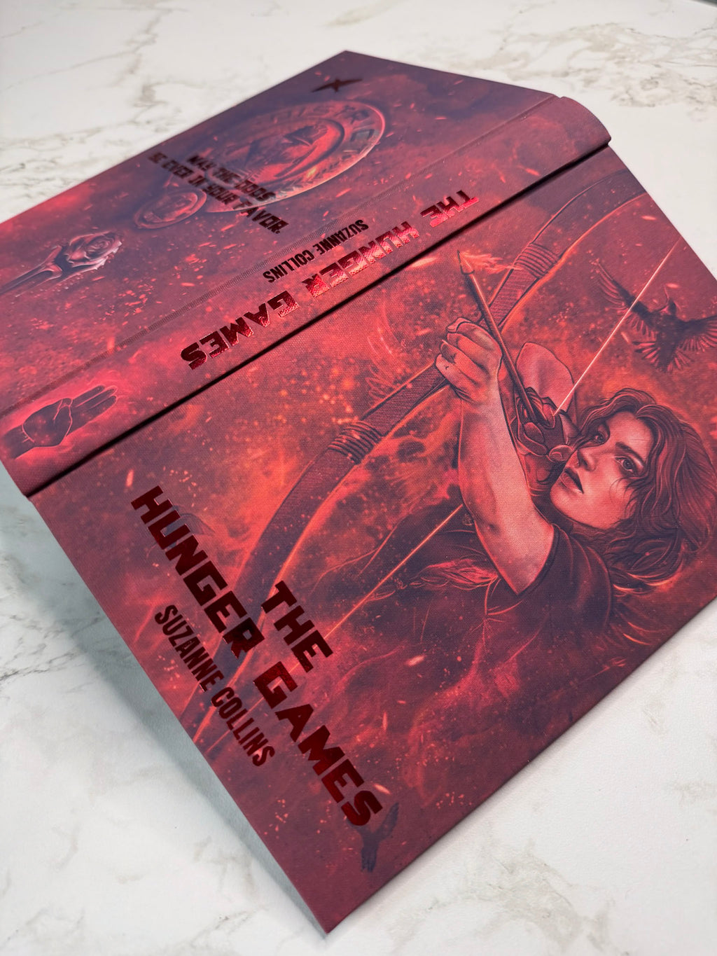 The Hunger Games by Suzanne Collins in Collaboration with Atreiyus
